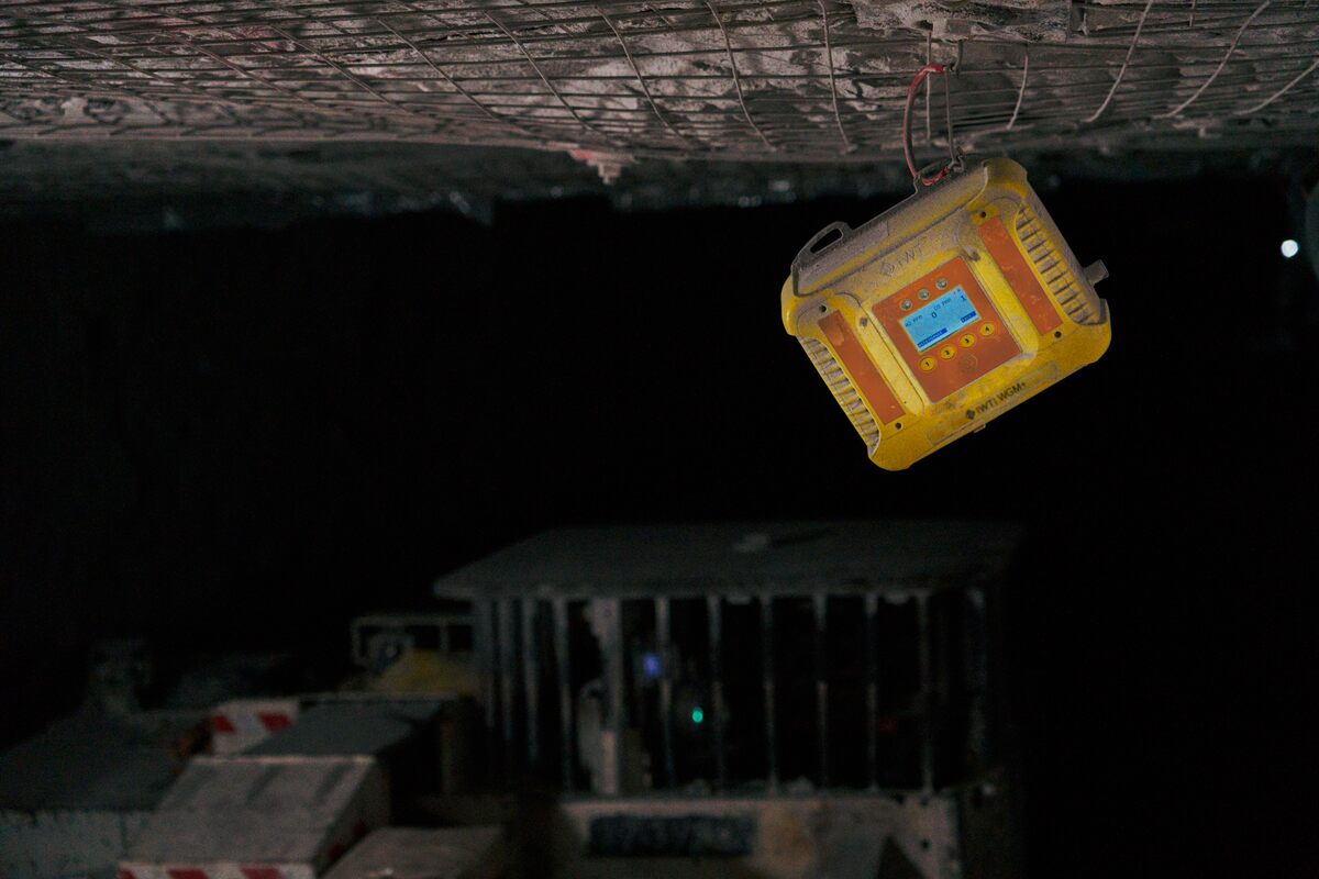 yellow electronics box attached to ceiling in mine